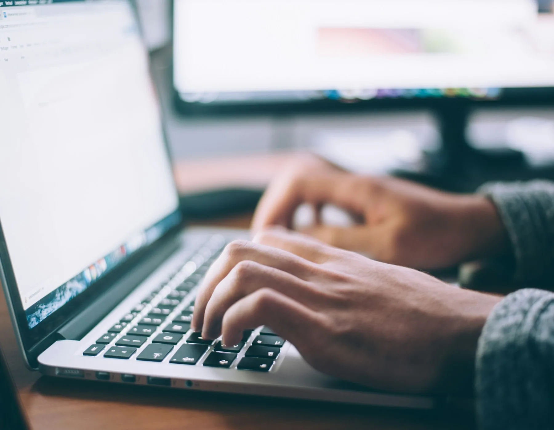 Employee working with AI on a laptop